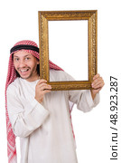 Arab with picture frame on white. Стоковое фото, агентство Ingram Publishing / Фотобанк Лори
