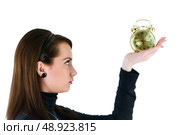Woman with clock isolated on the white. Стоковое фото, агентство Ingram Publishing / Фотобанк Лори