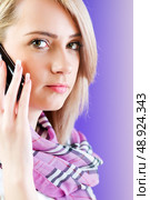 Blond girl talking on mobile phone. Стоковое фото, агентство Ingram Publishing / Фотобанк Лори
