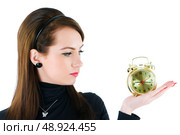 Woman with clock isolated on the white. Стоковое фото, агентство Ingram Publishing / Фотобанк Лори