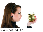 Woman with clock isolated on the white. Стоковое фото, агентство Ingram Publishing / Фотобанк Лори