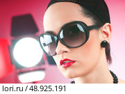 Young attractive girl with in the studio shooting. Стоковое фото, агентство Ingram Publishing / Фотобанк Лори