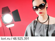 Young attractive girl with in the studio shooting. Стоковое фото, агентство Ingram Publishing / Фотобанк Лори