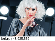 Young attractive girl with in the studio shooting. Стоковое фото, агентство Ingram Publishing / Фотобанк Лори