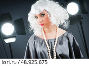 Young attractive girl with in the studio shooting. Стоковое фото, агентство Ingram Publishing / Фотобанк Лори