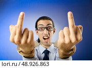 Businessman handcuffed in studio shooting. Стоковое фото, агентство Ingram Publishing / Фотобанк Лори