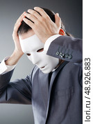 Industrial espionate concept with masked businessman. Стоковое фото, агентство Ingram Publishing / Фотобанк Лори