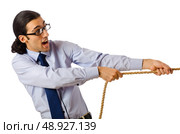 Businessman in tug of war concept. Стоковое фото, агентство Ingram Publishing / Фотобанк Лори