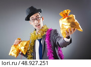 Businessman with sacks of presents. Стоковое фото, агентство Ingram Publishing / Фотобанк Лори
