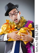 Businessman with sacks of presents. Стоковое фото, агентство Ingram Publishing / Фотобанк Лори