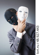 Industrial espionate concept with masked businessman. Стоковое фото, агентство Ingram Publishing / Фотобанк Лори