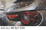 The backlight of a silver color electric car. Стоковое видео, видеограф Константин Шишкин / Фотобанк Лори