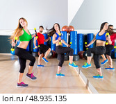 zumba dance cardio people group training at fitness gym workout exercise. Стоковое фото, агентство Ingram Publishing / Фотобанк Лори