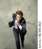 Young handsome businessman achieving the succes. Стоковое фото, агентство Ingram Publishing / Фотобанк Лори