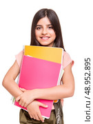 Beautiful little girl holding sketchbooks over white. Стоковое фото, агентство Ingram Publishing / Фотобанк Лори