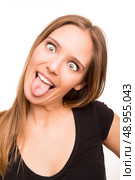 Blonde girl doing crazy and silly faces. Стоковое фото, агентство Ingram Publishing / Фотобанк Лори