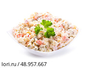 bowl of traditional russian salad on white background. Стоковое фото, агентство Ingram Publishing / Фотобанк Лори