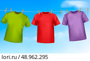 Set of colored t-shirts hanging on a clothesline. Стоковая иллюстрация, агентство Ingram Publishing / Фотобанк Лори