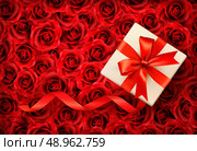 Holiday background with gift box and red bow on background of red flowers. Vector illustration. Стоковая иллюстрация, агентство Ingram Publishing / Фотобанк Лори