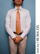 Young man wearing a white shirt and tie. Стоковое фото, агентство Ingram Publishing / Фотобанк Лори