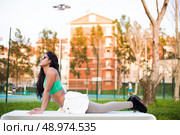 Fitness woman doing exercises in the city park. Стоковое фото, агентство Ingram Publishing / Фотобанк Лори
