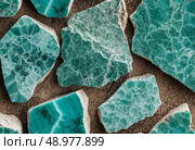 Chunks of amazonite showcase their stunning turquoise hues and striking patterns, inviting appreciation of their unique textures and natural artistry in diverse arrangements Generative AI. Стоковое AI-изображение, AI-художник Юлия Петровская / Фотобанк Лори