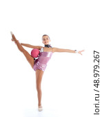 Kid girl ball rhythmic gymnastics exercise on white background. Стоковое фото, агентство Ingram Publishing / Фотобанк Лори