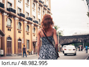 A young caucasian woman is walking in Manila. Стоковое фото, агентство Ingram Publishing / Фотобанк Лори