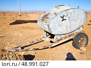 water tank in morocco africa land gray  metal weel and arid. Стоковое фото, агентство Ingram Publishing / Фотобанк Лори