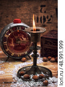 set foto burning Christmas candle in  brass candlesticks. Стоковое фото, агентство Ingram Publishing / Фотобанк Лори