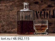 seasoned brandy into the glasses and decanter vintage style. Стоковое фото, агентство Ingram Publishing / Фотобанк Лори