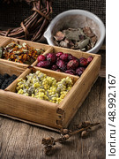 wooden box with herbs traditional medicine from home kit in the rural style.Selective focus. medicinal herb. Стоковое фото, агентство Ingram Publishing / Фотобанк Лори