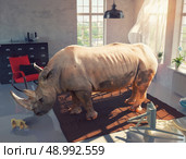 rhinoceros in the room looking at the wooden toy. Photo combinated concept. Стоковое фото, агентство Ingram Publishing / Фотобанк Лори