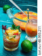 fresh tropical fruit juices. glass with drink of freshly squeezed tropical fruit with pulp.Selective focus.Photo tinted. Стоковое фото, агентство Ingram Publishing / Фотобанк Лори