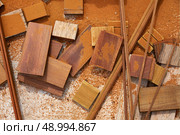 Carpeenter sawdust and decking pieces after ipe wood deck work. Стоковое фото, агентство Ingram Publishing / Фотобанк Лори