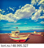 Almeria Cabo de Gata San Miguel beach boats in Spain. Стоковое фото, агентство Ingram Publishing / Фотобанк Лори