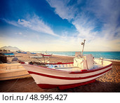 Almeria Cabo de Gata San Miguel beach boats in Spain. Стоковое фото, агентство Ingram Publishing / Фотобанк Лори