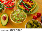 Mexican food mixed guacamole nachos chili sauce dipping cheddar cheese lemon pico de gallo. Стоковое фото, агентство Ingram Publishing / Фотобанк Лори