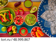Mexican food mixed guacamole nachos chili sauce dipping cheddar cheese lemon pico de gallo. Стоковое фото, агентство Ingram Publishing / Фотобанк Лори