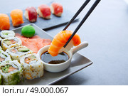 Sushi Maki and Niguiri with soy sauce and wasabi with California Roll. Стоковое фото, агентство Ingram Publishing / Фотобанк Лори