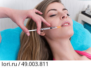 Woman getting anticellulite and anti fat therapy in beauty salon. Стоковое фото, агентство Ingram Publishing / Фотобанк Лори