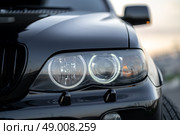 KRASNOYARSK, RUSSIA - May 23, 2025: Black BMW X5 E53. Редакционное фото, фотограф Плотников Дмитрий / Фотобанк Лори