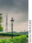 Lamp and pylons in cloudy weather. Стоковое фото, агентство Ingram Publishing / Фотобанк Лори