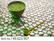 Matcha green tea from Japan on modern stainless steel background. Стоковое фото, агентство Ingram Publishing / Фотобанк Лори