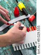 Tubes with varnish for nail polish of different colors . Стоковое фото, агентство Ingram Publishing / Фотобанк Лори