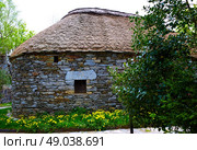 O Cebreiro by the way of Saint James in Galicia Palloza traditional celtic hut. Стоковое фото, агентство Ingram Publishing / Фотобанк Лори