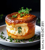 Delicious Souffl Served on a Plate Garnished With Fresh Thyme in a Dark Setting. Стоковое AI-изображение, AI-художник Юлия Гапеенко / Фотобанк Лори