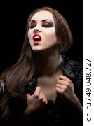 Young beautiful vampire woman isolated. Стоковое фото, агентство Ingram Publishing / Фотобанк Лори
