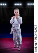 Little girl aikido fighter at sports hall. Стоковое фото, агентство Ingram Publishing / Фотобанк Лори