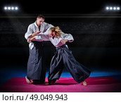Two aikido fighters at sports hall. Стоковое фото, агентство Ingram Publishing / Фотобанк Лори